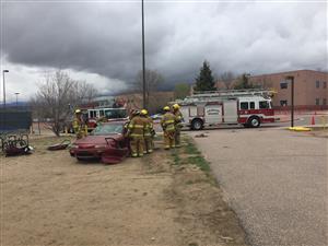  Colorado Springs Fire Department firefighters conduct a mock crash at Sand Creek High School 4/26.