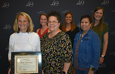 Ann Moomey, volunteer at Remington Elementary, receives a Fantastic 49 award. 
