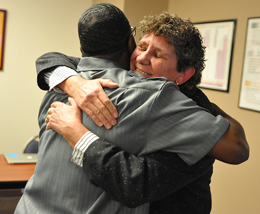  Karen Sandidge, PEAK Education Center, congratulates Kevin Westmoreland, paraprofessional, Jan. 9.