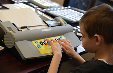 Student participates in nationwide Braille Challenge competition.