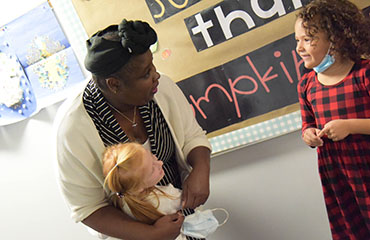  Shrisice Washington, guest teacher, is adored by students at Remington Elementary.