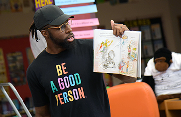 David Bruton Jr. visits Falcon Zone READ Camp. 