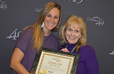  Jessica Cole receives an award during December Fantastic 49 celebration.