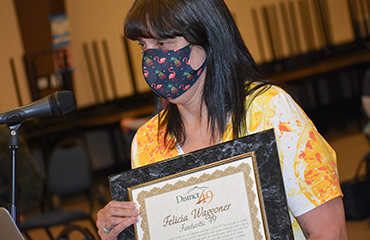 Felicia Waggoner, transportation dispatcher, is honored during April 8 Fantastic 49 festivities.