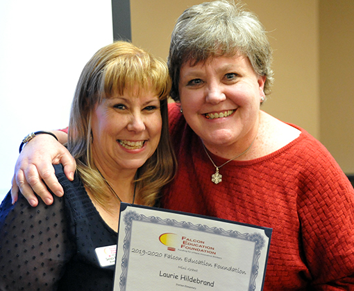 Laurie Hildebrand receives kudos as a Falcon Education Foundation mini grant recipient Dec. 12.