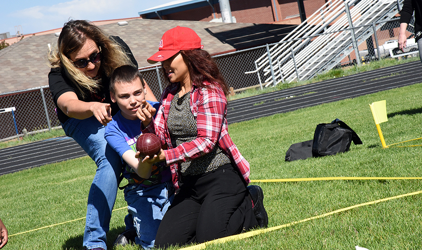   Students with special needs play bocce ball at Sand Creek High School June 7 during ESY.