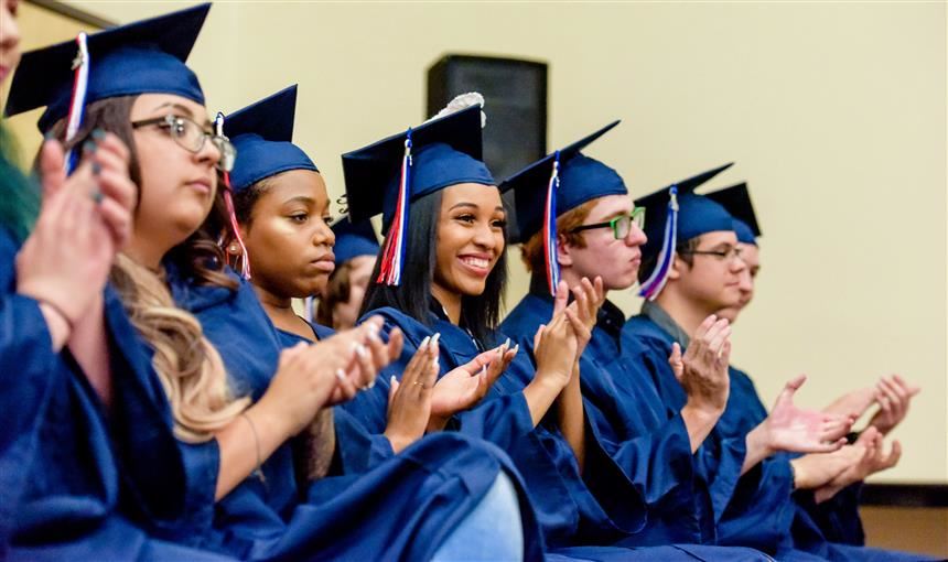  PHS graduates await receiving their diplomas May 18 at the Creekside Success Center.