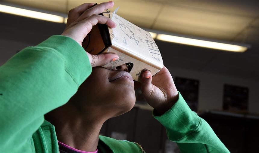  Naomi Perkins, SSAE fourth-grader, looks at the surface of the moon on a Google Expeditions Journey