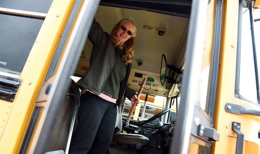  Leatha Hansz closes the door to her bus after conducting a safety check at the District 49 bus lot.