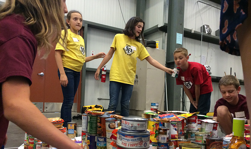  Baylea Larson and other Stetson Elementary School students work on their canstruction project.